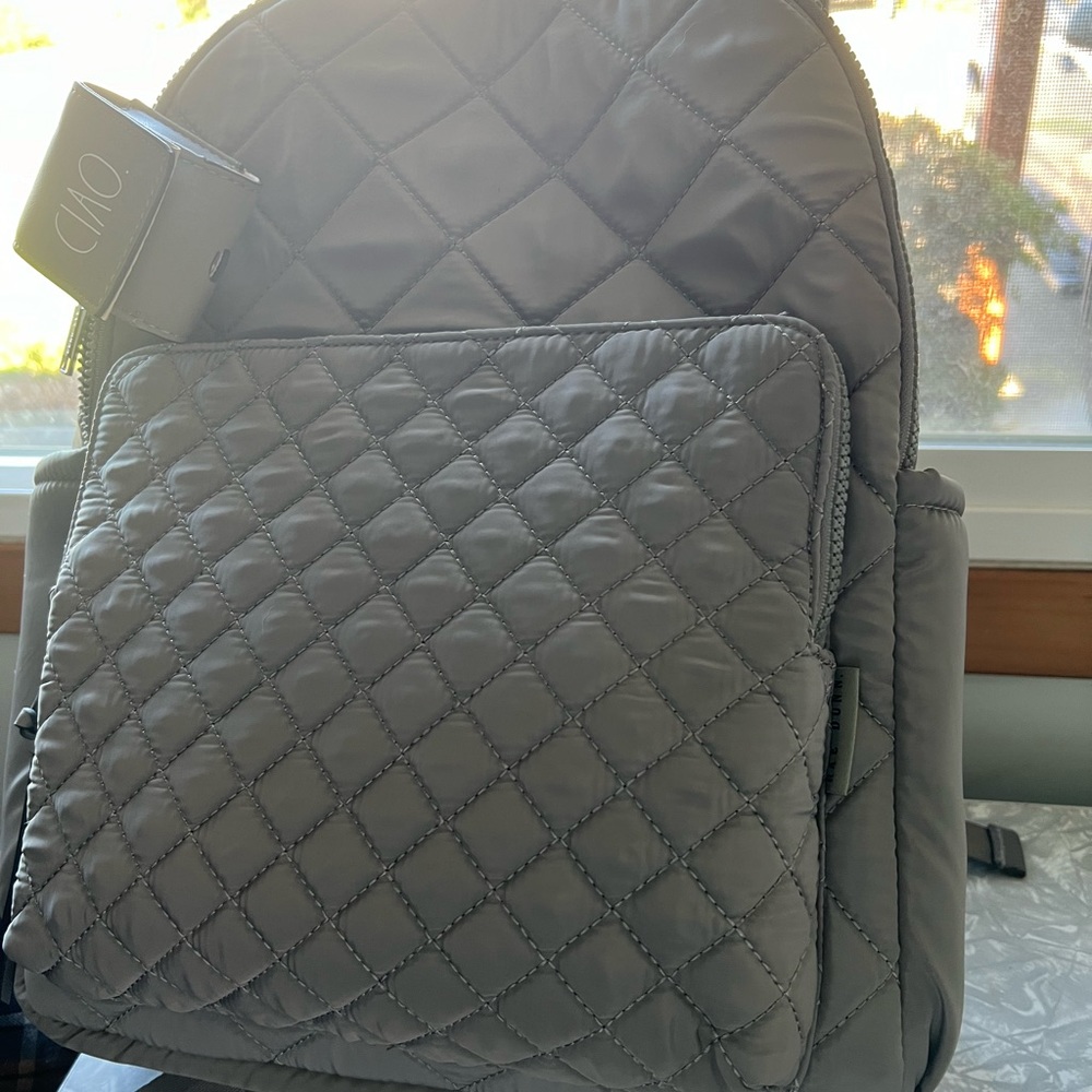 Rae Dunn back pack very cute comes with an small earbud case.